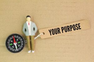 compass-miniature-person-paper-tag-with-word-your-purpose-concept-what-your-purpose_694006-4848