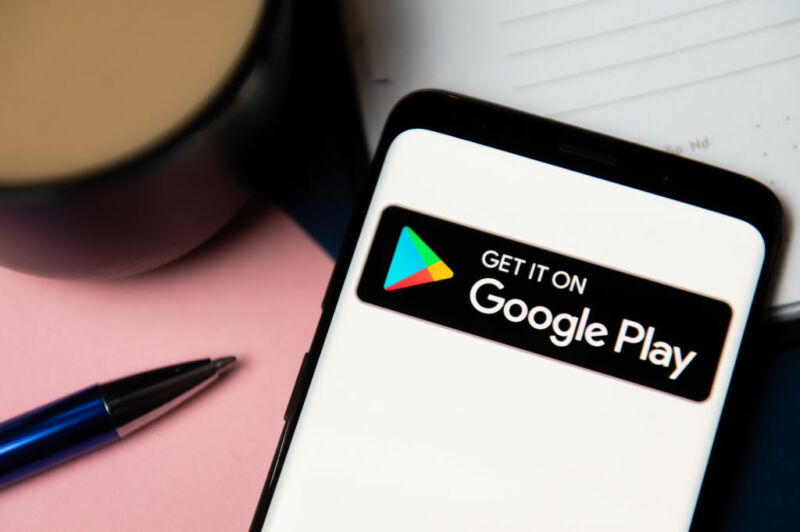 In this photo illustration a Google Play logo displayed on a
