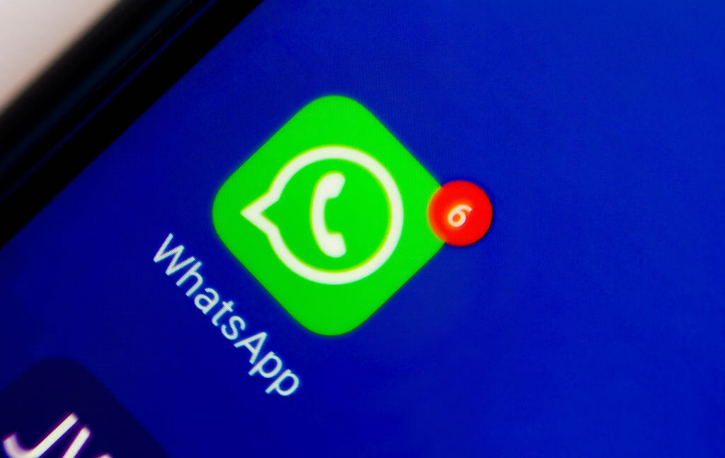 In this photo illustration an icon of WhatsApp app displayed