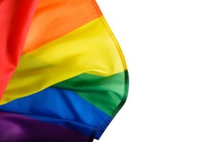 Rainbow flag isolate on white background, close-up of top few ...