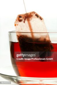 Removing Tea Bag From Cup Of Hibiscus Tea High-Res Stock Photo ...