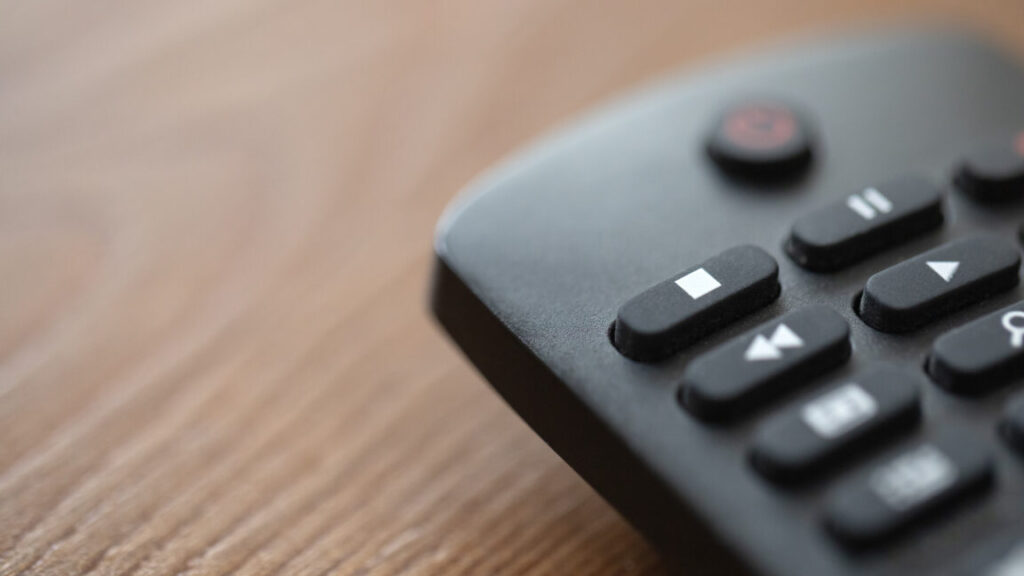 Close up view of smart tv remote on the table stock photo
