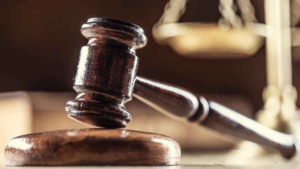 The judge's gavel and scales as a symbol of the judiciary and justice.