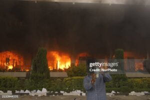 Smoke billows from the Federal Parliament building of Nepal as ...