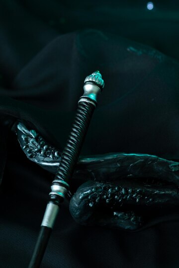 The top of the magic wand is decorated with decorative spiral ...